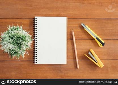 Minimal work space - Creative flat lay photo of workspace desk. Office desk wooden table background with open mock up notebooks and pens and plant. Top view with copy space, flat lay photography.