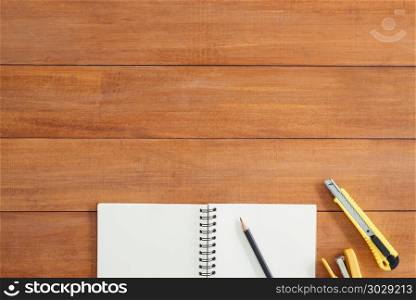 Minimal work space - Creative flat lay photo of workspace desk. . Minimal work space - Creative flat lay photo of workspace desk. Office desk wooden table background with open mock up notebooks and pens and plant. Top view with copy space, flat lay photography.