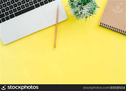 Minimal work space - Creative flat lay photo of workspace desk. . Minimal work space - Creative flat lay photo of workspace desk. Top view office desk with laptop, notebooks and plant copy space on color background. Top view with copy space, flat lay photography.