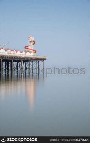 Minimalist fine art image of colorful old pier in foggy morning . Minimalist fine art image of colorful pier in foggy morning light
