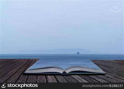 Minimalist image of single freight boat in open sea conceptual book image