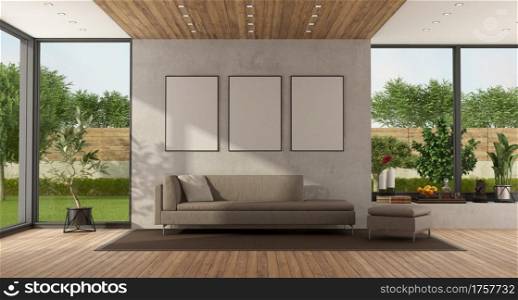 Minimalist living room with garden on background and modern sofa against concrete wall - 3d rendering. Modern living room with large window and sofa