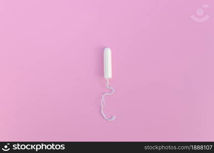 minimalist tampon pink background top view . Resolution and high quality beautiful photo. minimalist tampon pink background top view . High quality and resolution beautiful photo concept