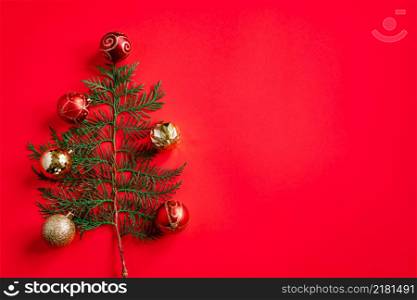 Minimalistic Christmas tree on a red background. Place for text.. Minimalistic Christmas tree on red background. Place for text.