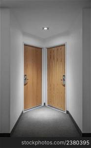 Minimalistic interior of hotel corridor with two symmetric doors