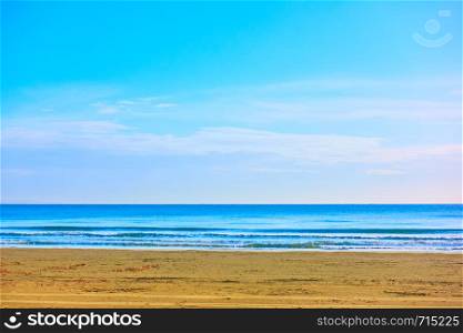 Minimalistic view of empty sandy beach and sea horizon