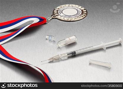 Miningful composition including syringe and gold medal.