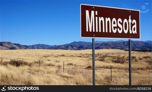 Minnesota road sign with blue sky and wilderness