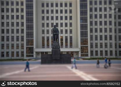 MINSK, BELARUS - SEPTEMBER 2, 2018: a statue of Lenin against the backdrop of the parliament building on the Independence Square in Minsk.