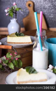 mint cheesecake on a plate and beautiful decor around