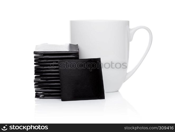 Mint chocolate thins on white background with tea cup.