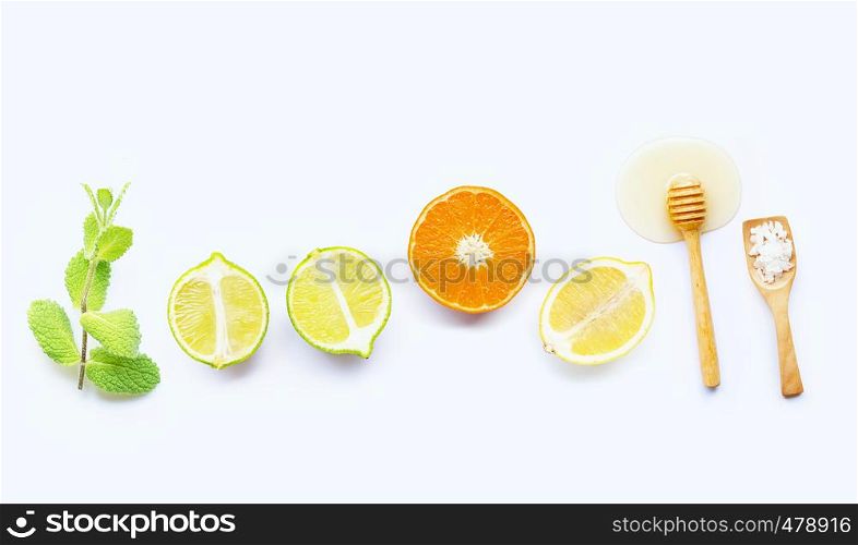 Mint, salt and honey with citrus tropical fruit isolated on white