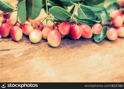 Miracle fruit on old wooden table