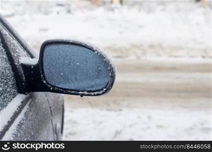 Mirror car covered with snow