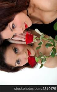Mirror image of a beautiful woman with a rose