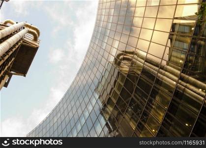 Mirror image of a building reflected on another one in London