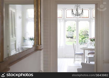 Mirror in hallway with view through to living room