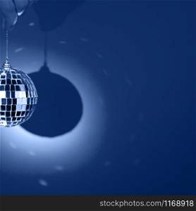 Mirror or disco ball, reflecting colorful lights on classic blue background. Party square banner with copy space.. Mirror or disco ball, reflecting colorful lights on classic blue background. Party banner.