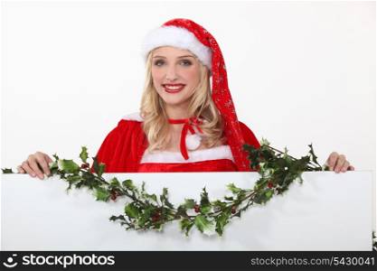 Miss Santa with a board left blank for your message