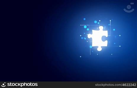Missing puzzle element. Jigsaw puzzle piece with light glow in hand