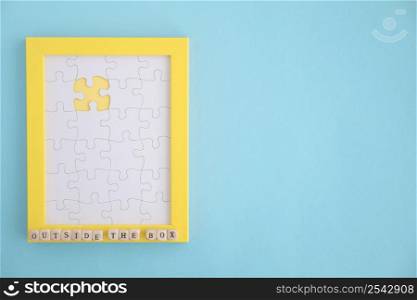 missing white jigsaw puzzle yellow frame blue background