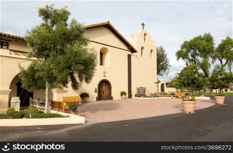 Mission Santa Ines in California exterior on sunny day with clouds