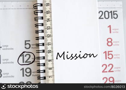 Mission text concept over tape measure and calendar background&#xA;&#xA;