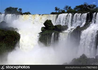 Mist and wide Iguazu waterfall in Argentina