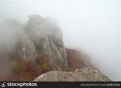 Mist in the mountains- landscape with clouds and rocks