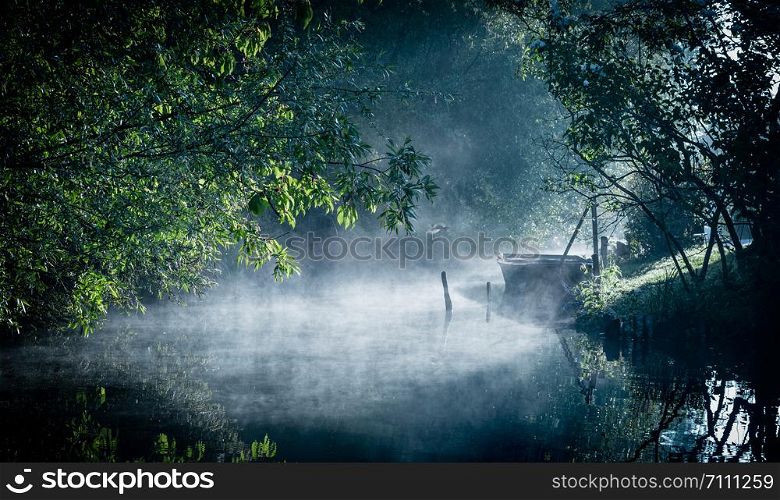 Mist on the river at dawn in the marshes of Bourges, Centre-Val de Loire, France