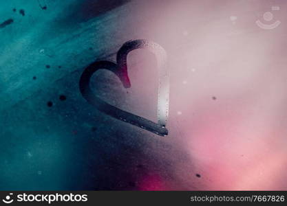 Misted Glass with Drawing Heart on It. Abstract Blurry Pink and Blue Background. Valentine Day Greeting Card. Love Concept.