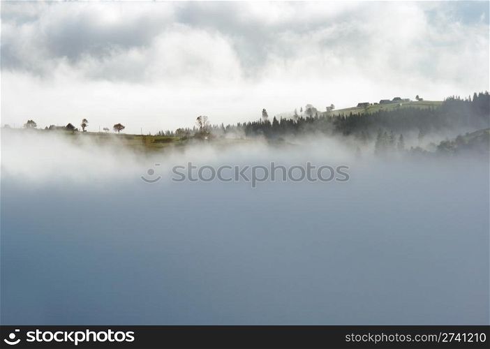 Misty daybreak in autumn Carpathian mountain, Ukraine.