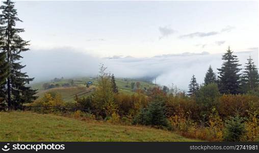 Misty daybreak in autumn Carpathian mountain, Ukraine. Four shots stitch image.