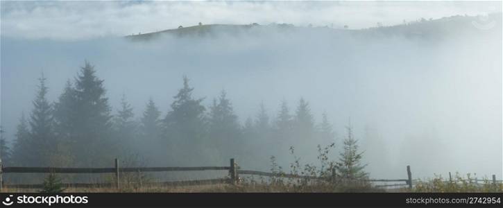 Misty daybreak in autumn Carpathian mountain, Ukraine. Six shots stitch image.