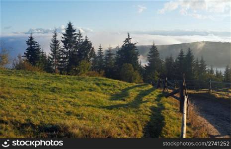 Misty daybreak in autumn Carpathian mountain, Ukraine. Ten shots stitch image.