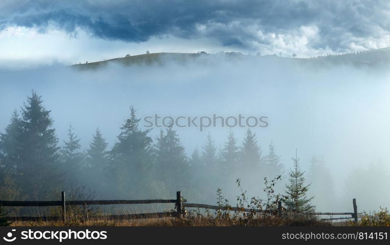 Misty daybreak in autumn cloudy Carpathian mountain, Ukraine.