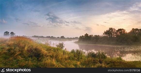Misty river in the morning. Panorama. Warm summer morning. Summer misty sunrise panoramic landscape