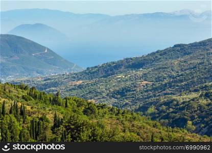 Misty summer hilly coast panorama (Greece, Lefkada). View from up.