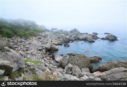 Misty summer stony coast landscape (Crimea, Ukraine)