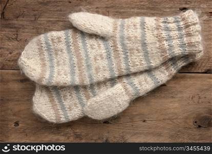 mittens on a wooden background