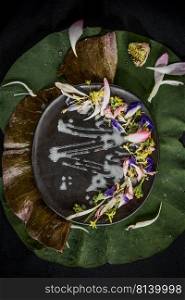  Mix edible flower salad on lotus leaf.  