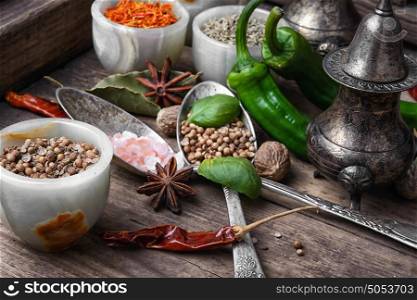 mix hot spices. large set of Indian spices in spoons and bowls