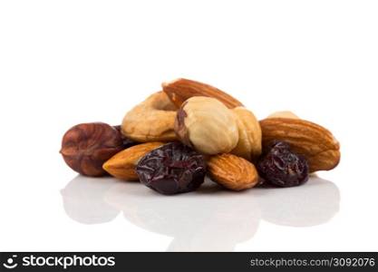 Mix nuts, dry fruits and grapes on a white background