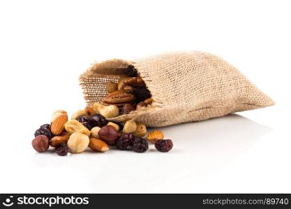 Mix nuts, dry fruits and grapes on a white background in hessian bag