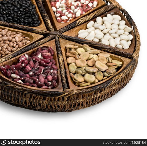 mix of beans and peas on a wooden plate