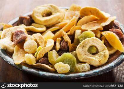 mix of dried fruits on wooden table
