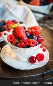 Mix of fresh berries in a cup of tea