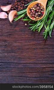 mix pepper with fresh rosemary on a table