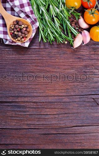 mix pepper with fresh rosemary on a table