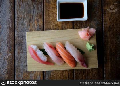 Mix sushi tuna salmon sea bass sushi on wood background japanese food
